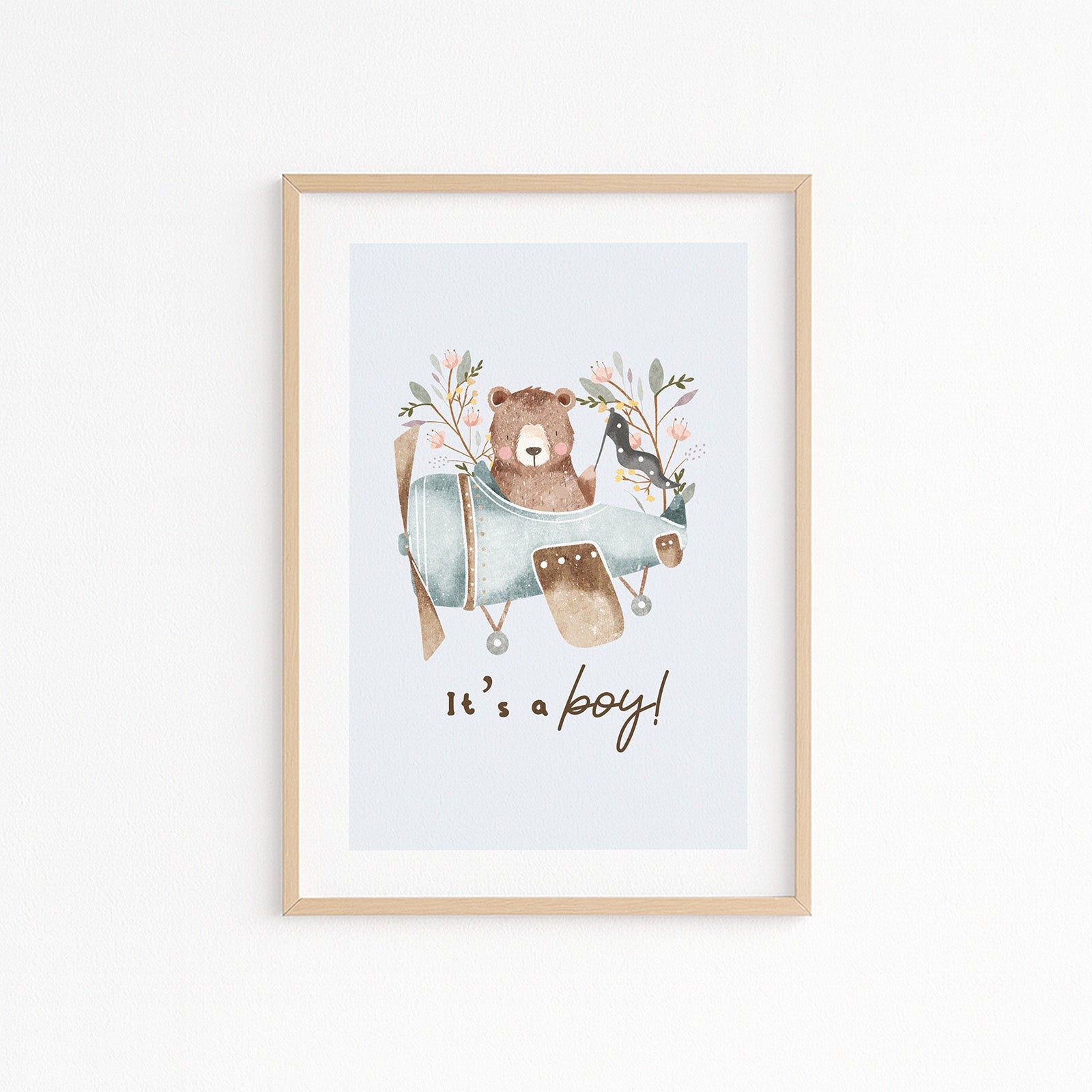 Kinderzimmerbild mit einem Bär in einem Flugzeig und dem Text it´s a boy poster für das Kinderzimmer
